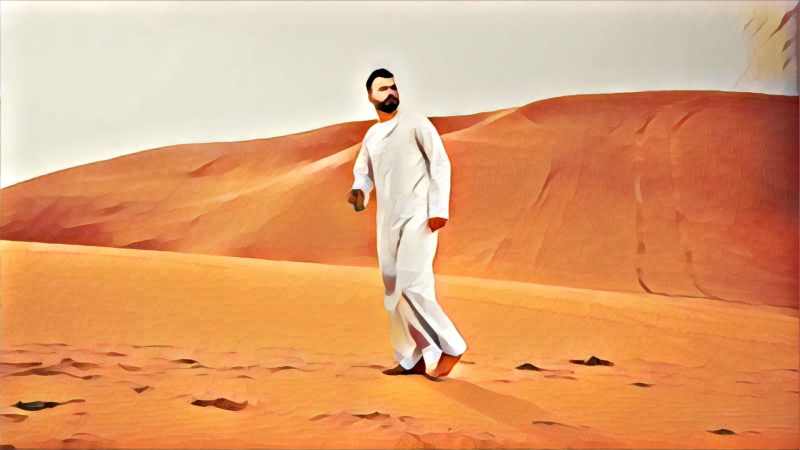 guy walking in the desert thobe white