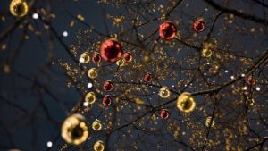 red and gold colored Christmas ornaments in a tree