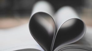 two pages in a book in the shape of a heart