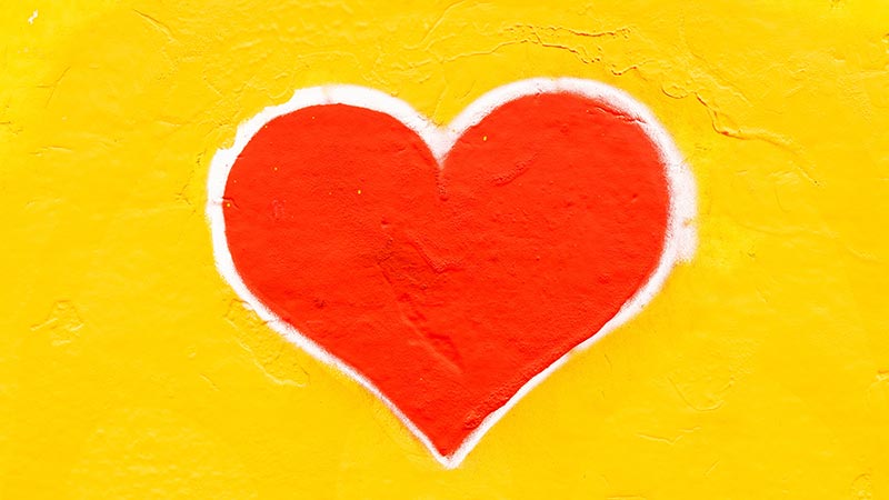 red heart on yellow background painted