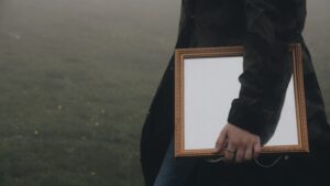 man carrying a mirror