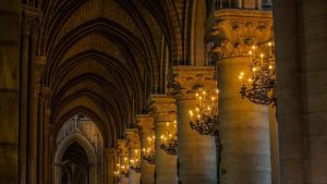 pilars with candles on them in a church