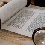 scroll of the torah on table